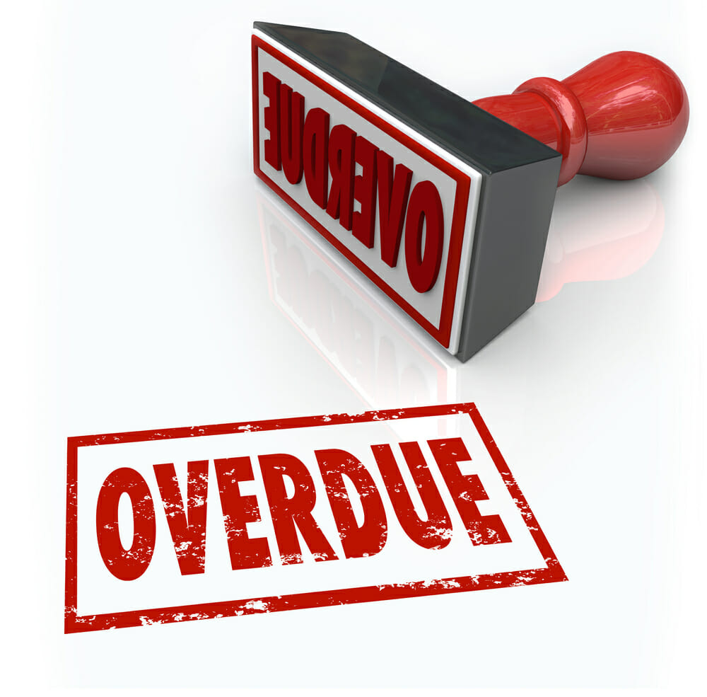Overdue word in a red stamp to illustrate a late or missed payment or delayed response past a deadline