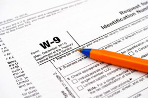 Form W-9, Request for Taxpayer Identification Number (TIN) and Certification with pen
